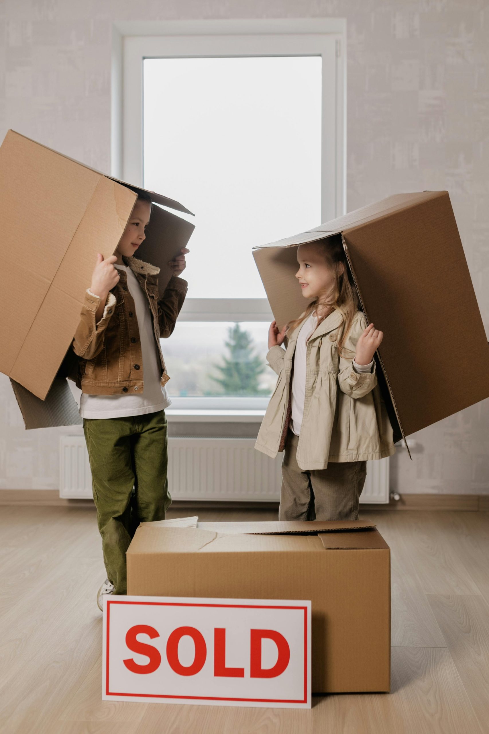 Children carrying boxes